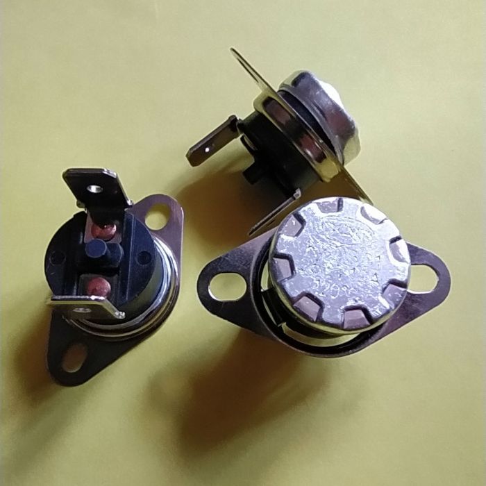 KSD301 10A 250В 120°C термостат   з кнопкою (норм/замкн.,верт.контакти,рухомий фланець)